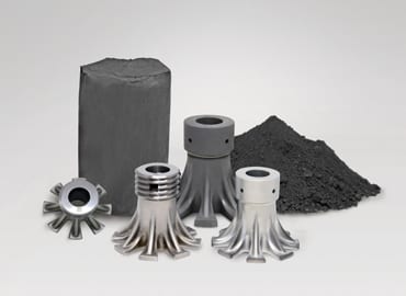Carbide tools in front of a pile of carbide
